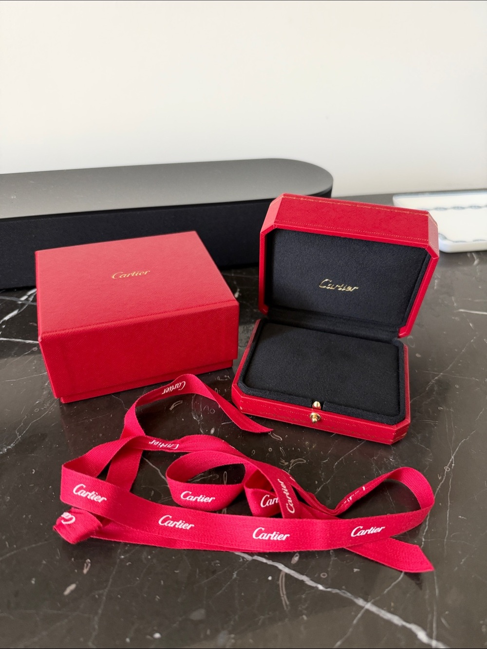 Cartier jewelry box and case with branded ribbon